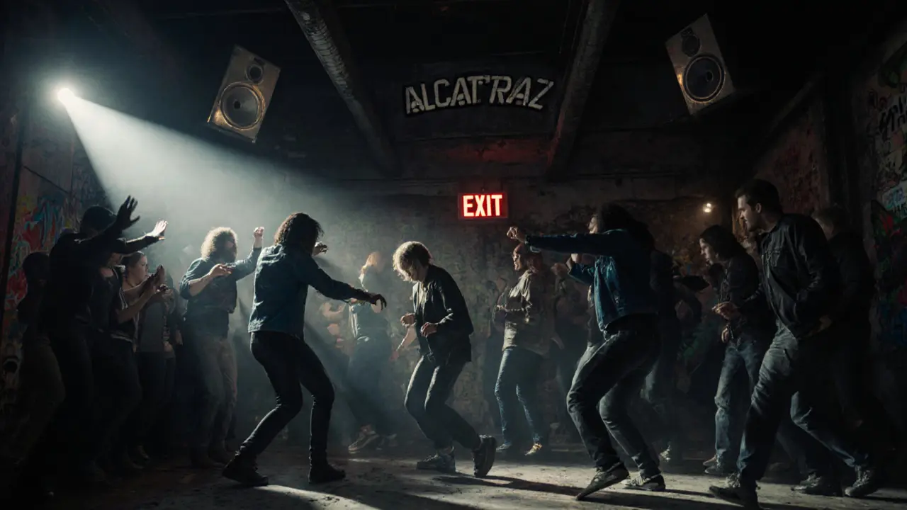 Alcatraz club interior with energetic crowd dancing under strobing industrial lights.
