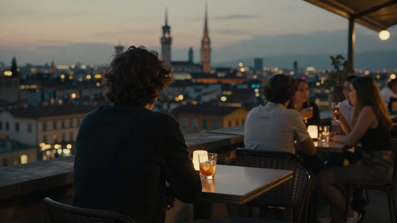 Someone sitting alone at a rooftop bar in Isola, overlooking Milan's glowing skyline at dusk.